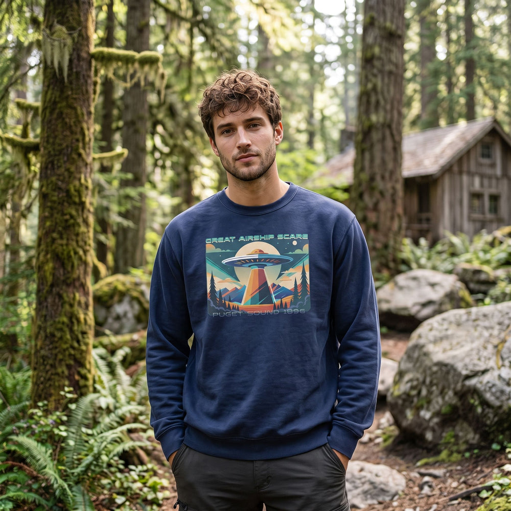 Casual model wearing vintage-style 1896 Airship Scare crewneck sweatshirt outdoors with greenery and sky elements, emphasizing historical design.