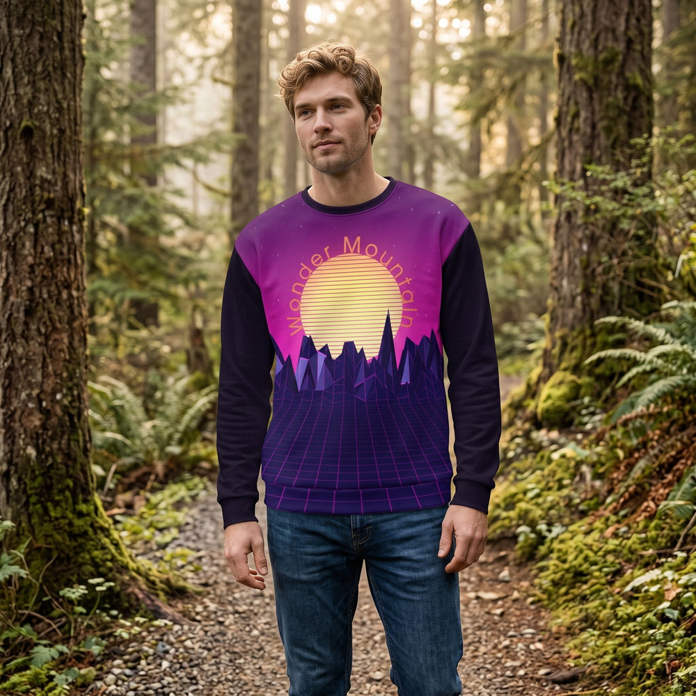 Man showcasing vibrant Wonder Mountain sweatshirt in cozy indoor living space.