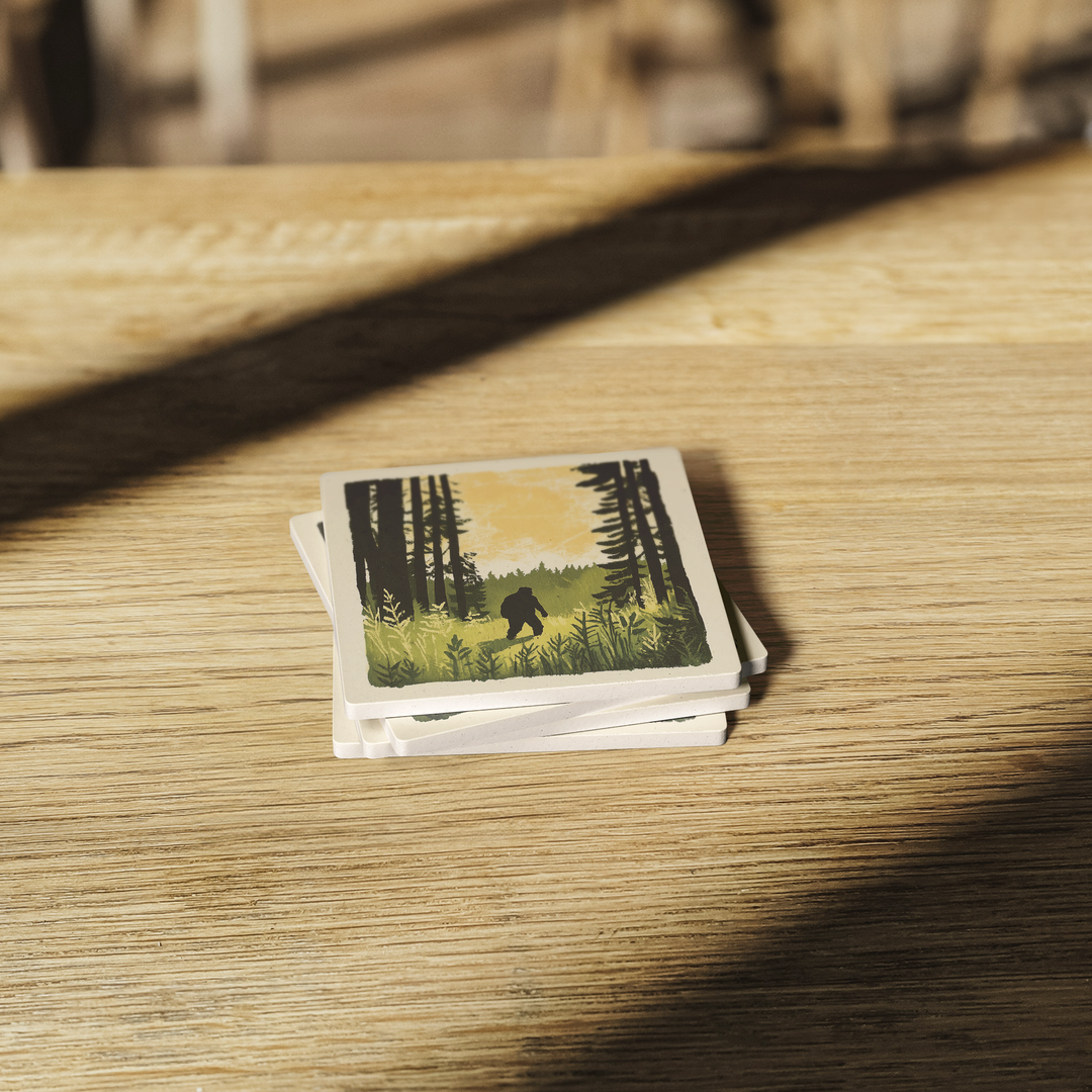 Sasquatch_Stroll_SquareStoneCoaster_WoodTable_AS_Mockup.png