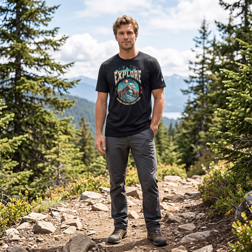 Aliens Explore T-Shirt in outdoor nature setting with greenery and bright sunlight, featuring a casual model in a polished style.