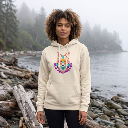 Model Zara showcasing vibrant Trail Trickster Hoodie with bold background in a pop art scene emphasizing casual urban style.