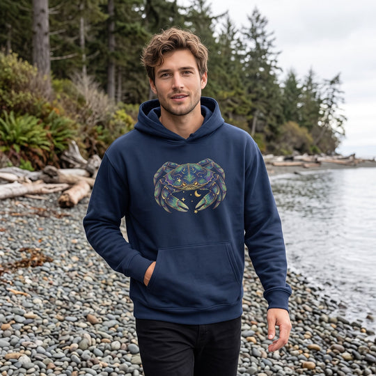 Casual model wearing the Cancer Dungeness Crab hoodie in an outdoor setting with greenery, capturing natural daylight and a relaxed vibe.