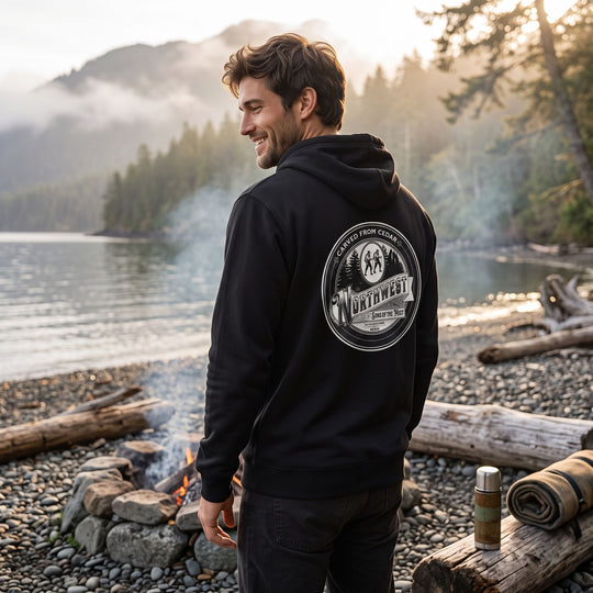 Casual man wearing Cedar hoodie in a warm, cozy living room setting, illustrating comfort and rugged style for outdoor enthusiasts.