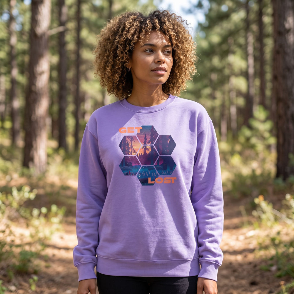 Adult model wearing Get Lost Mosaic Sweatshirt in an outdoor natural setting with greenery, capturing a casual, adventurous vibe