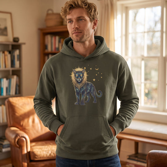Adult male model wears Leo Cougar organic fleece hoodie in cozy living room setting, showcasing casual style and comfort.