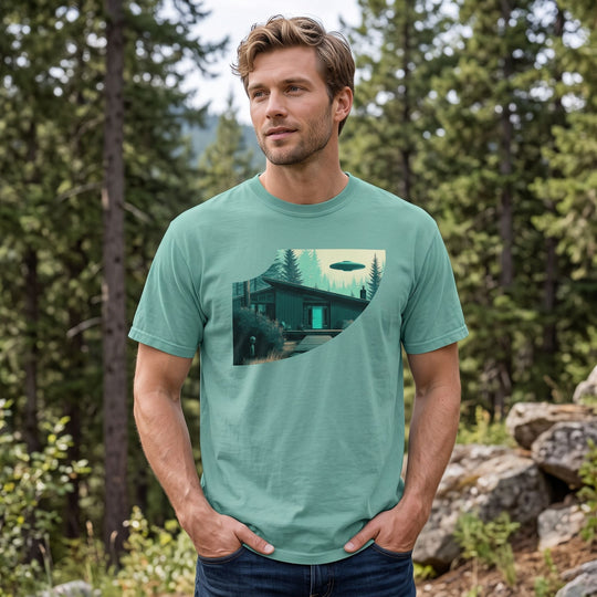 Adult model Ben wearing the vintage-style graphic tee in a bright outdoor environment with greenery and blurred foliage.