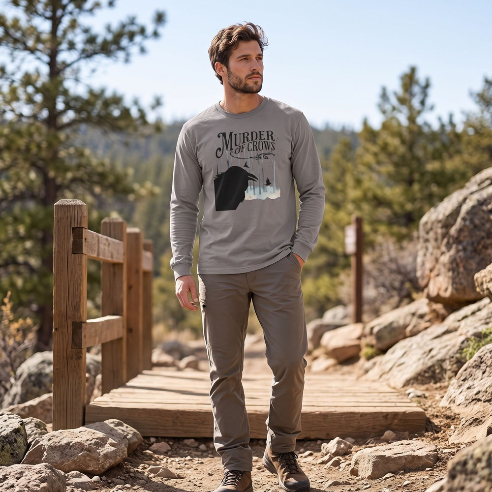 Woman wearing Murder of Crows long-sleeve tee outdoors with greenery and natural daylight