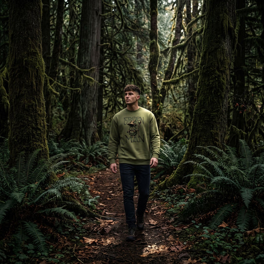 Model showcasing Green Man forest guardian sweatshirt with relaxed fit inside mysterious lighting setting.