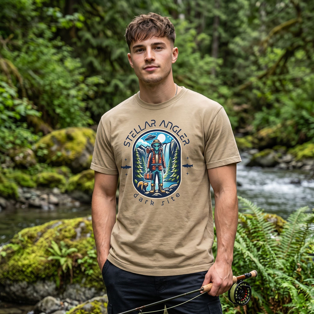 Casual young man in outdoor environment wearing The Stellar Angler Dark Site Tee, emphasizing relaxed, outdoors apparel.
