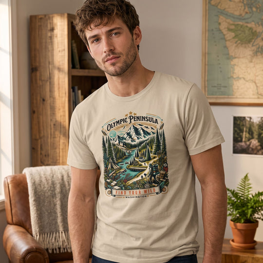 Casual man relaxing in a cozy living room wearing Olympic Untamed Tee showcasing outdoor adventure spirit