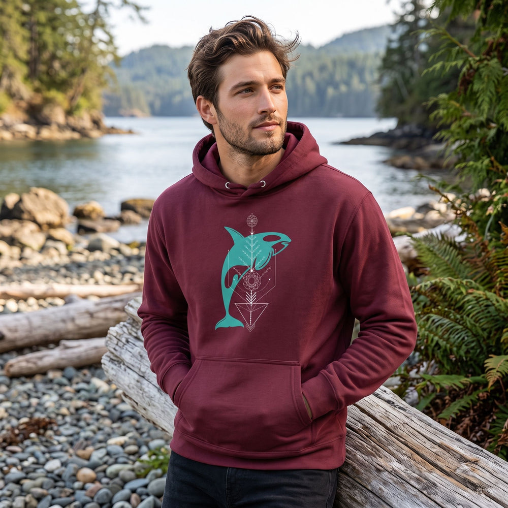 Men's Orca Magic Hoodie worn outdoors with natural daylight, greenery in the background, capturing a relaxed casual style.