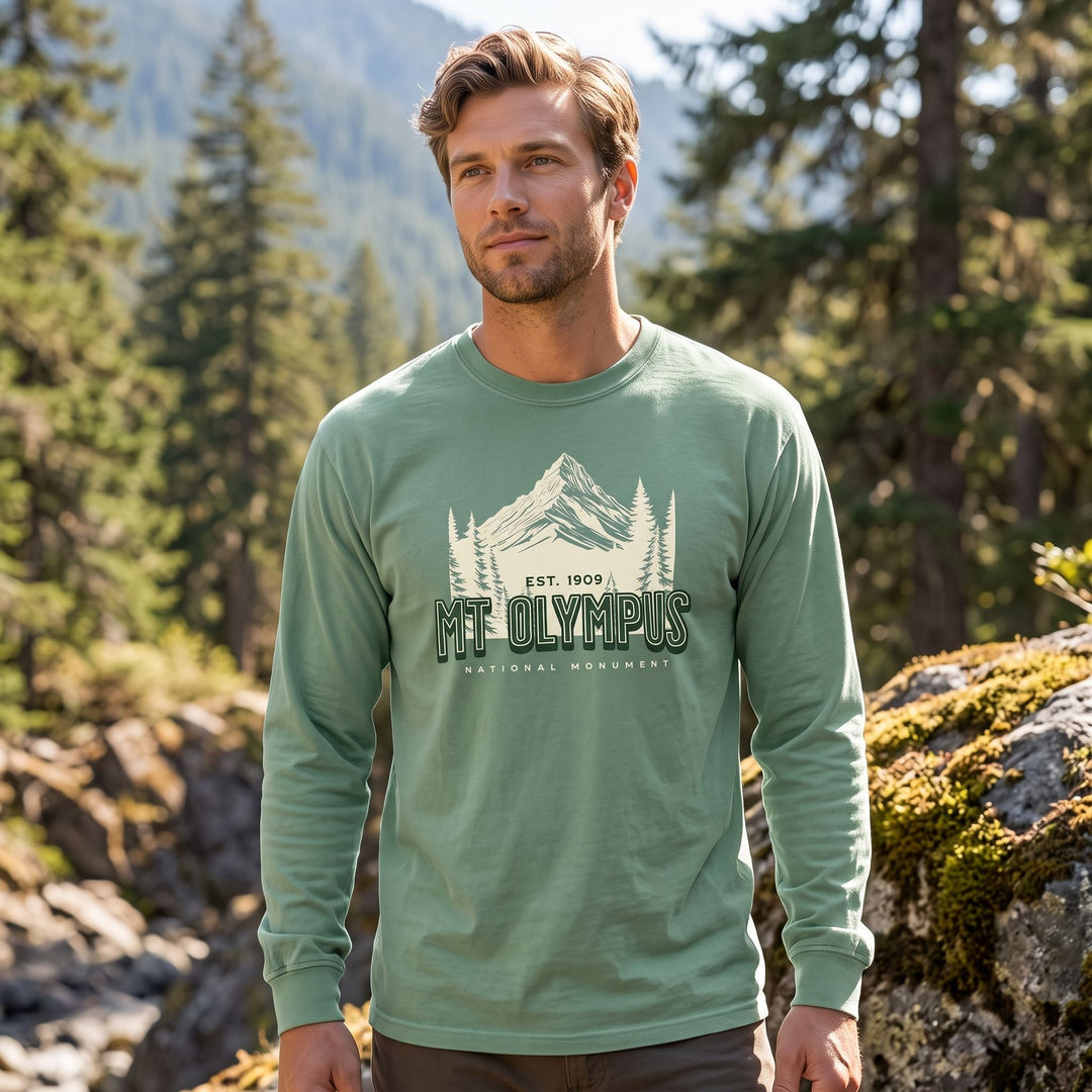 Adult male model styled casually in Mount Olympus shirt, surrounded by natural outdoor elements and bright sunlight.