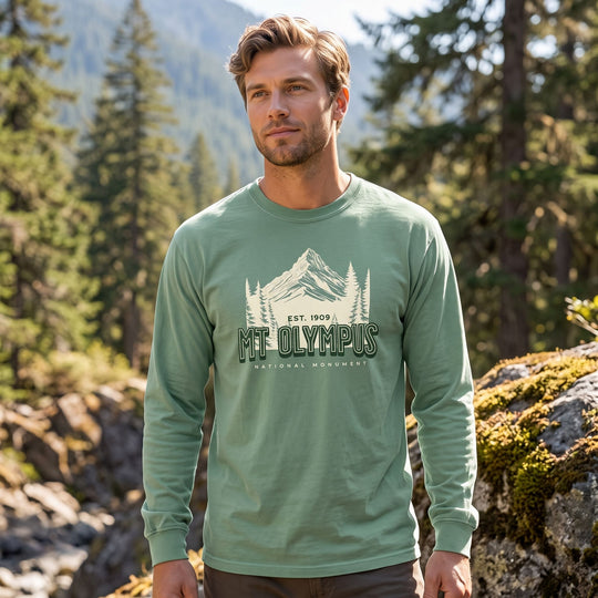 Adult male model styled casually in Mount Olympus shirt, surrounded by natural outdoor elements and bright sunlight.