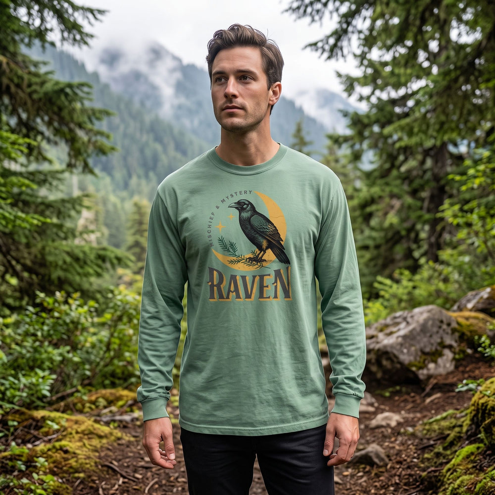 Long-sleeve shirt hanging outdoors on a rustic hanger with blurred green foliage background, showcasing fabric texture and relaxed fit.