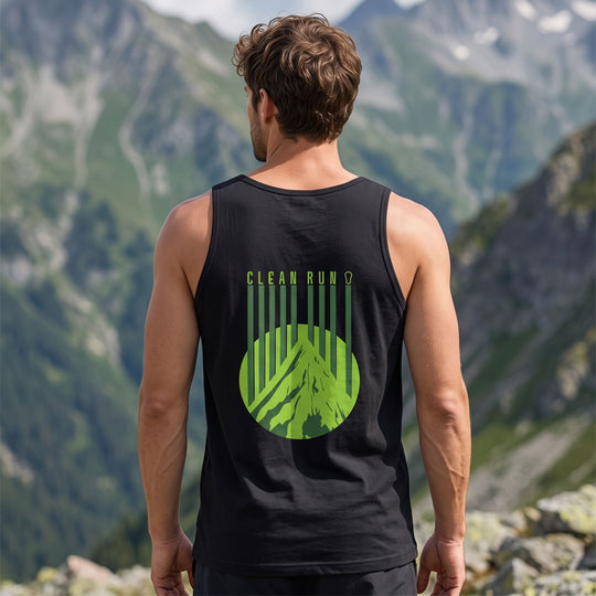 Model wearing Clean Run Ascent Tank outdoors in natural daylight with greenery and rocky landscape, emphasizing a relaxed and active vibe.