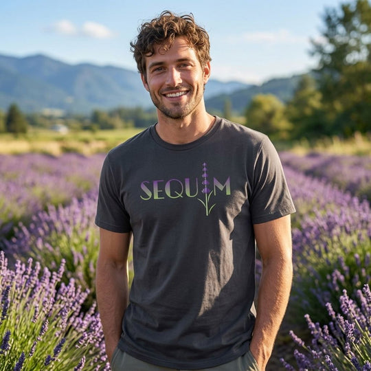 Relaxed outdoor scene featuring a model wearing the Rain Shadow Lavender Organic Tee with greenery and natural daylight.