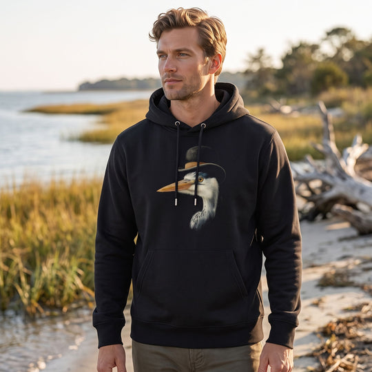 Outdoor scene with model Ben wearing The Shoreline Sophisticate heavyweight hoodie amid greenery and water, capturing a natural and fresh atmosphere.