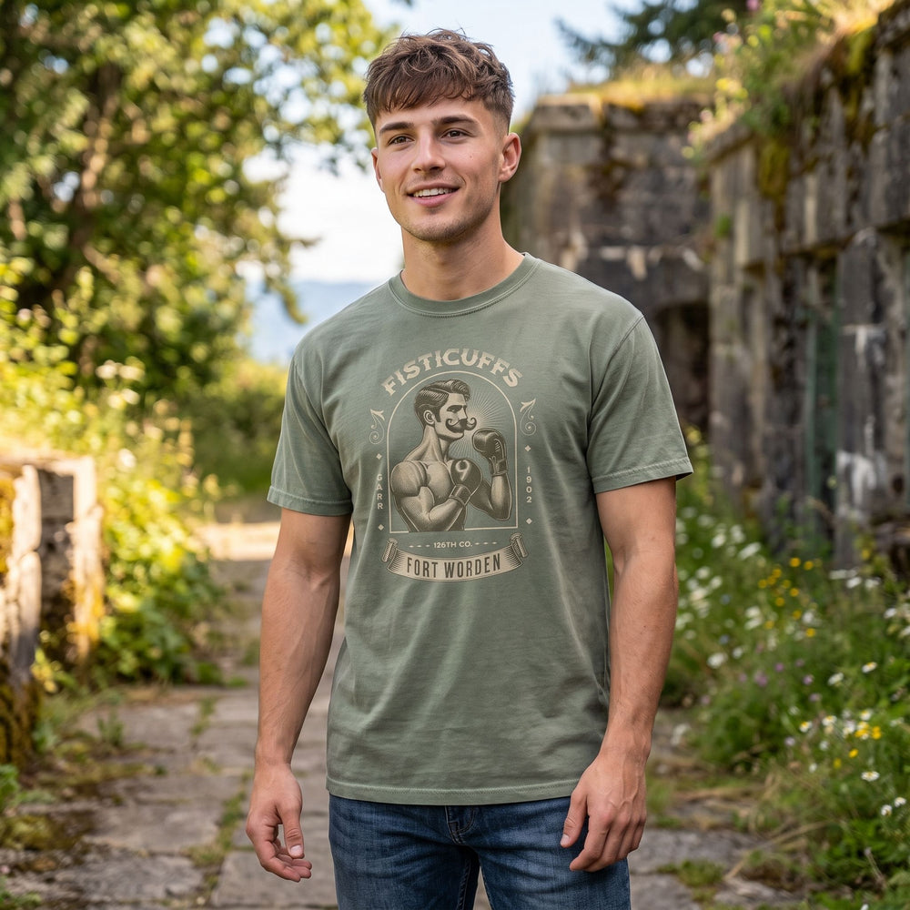 Model Noah in casual attire displaying the rugged Fort Worden vintage T-shirt with nature backdrop.