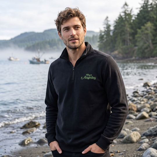 Relaxed-fit Port Angeles fleece pullover on model outdoors in natural daylight with greenery backdrop.