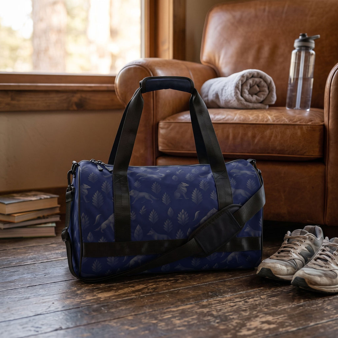 Shadow Pack gym bag with wolves motif held by a man in casual clothing, emphasizing durability and outdoor-inspired style in a inviting space.