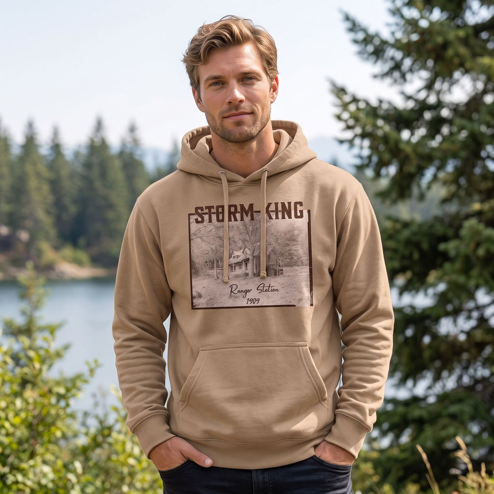 Model in outdoor scenery wearing the warm heavyweight Storm King Ranger Station hoodie, emphasizing rugged outdoor style.