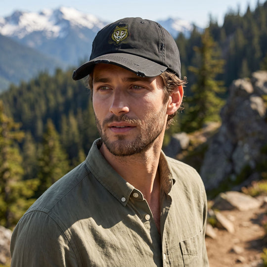 Casual male model wearing the Sacred Wolf Dad Hat in outdoor nature setting with greenery and natural sunlight, emphasizing rugged style and comfort.