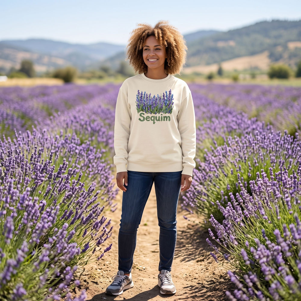 Adult model wearing Sequim Lavender Fields fleece in outdoor setting with greenery, showcasing the vibrant lavender graphic and streetwear style.
