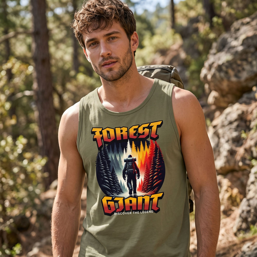 Casual man wearing the Forest Giant Summit Tank in outdoor greenery, showcasing its fit and comfortable design for wild exploration.