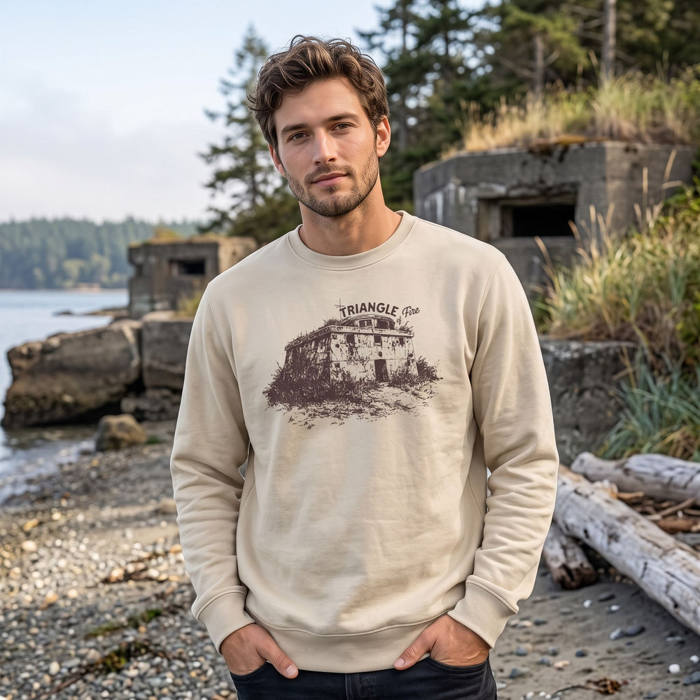Casual model wearing the Triangle of Fire Sweatshirt outdoors amid greenery, showcasing rugged style and natural fabric.
