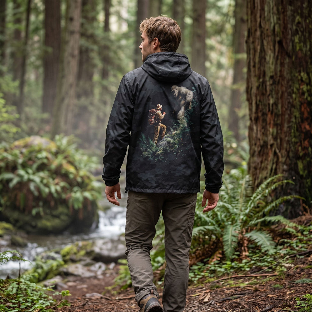 Outdoor scene featuring the Wild Thing Expedition Windbreaker on model Ben amidst greenery, highlighting its adventure-ready design.